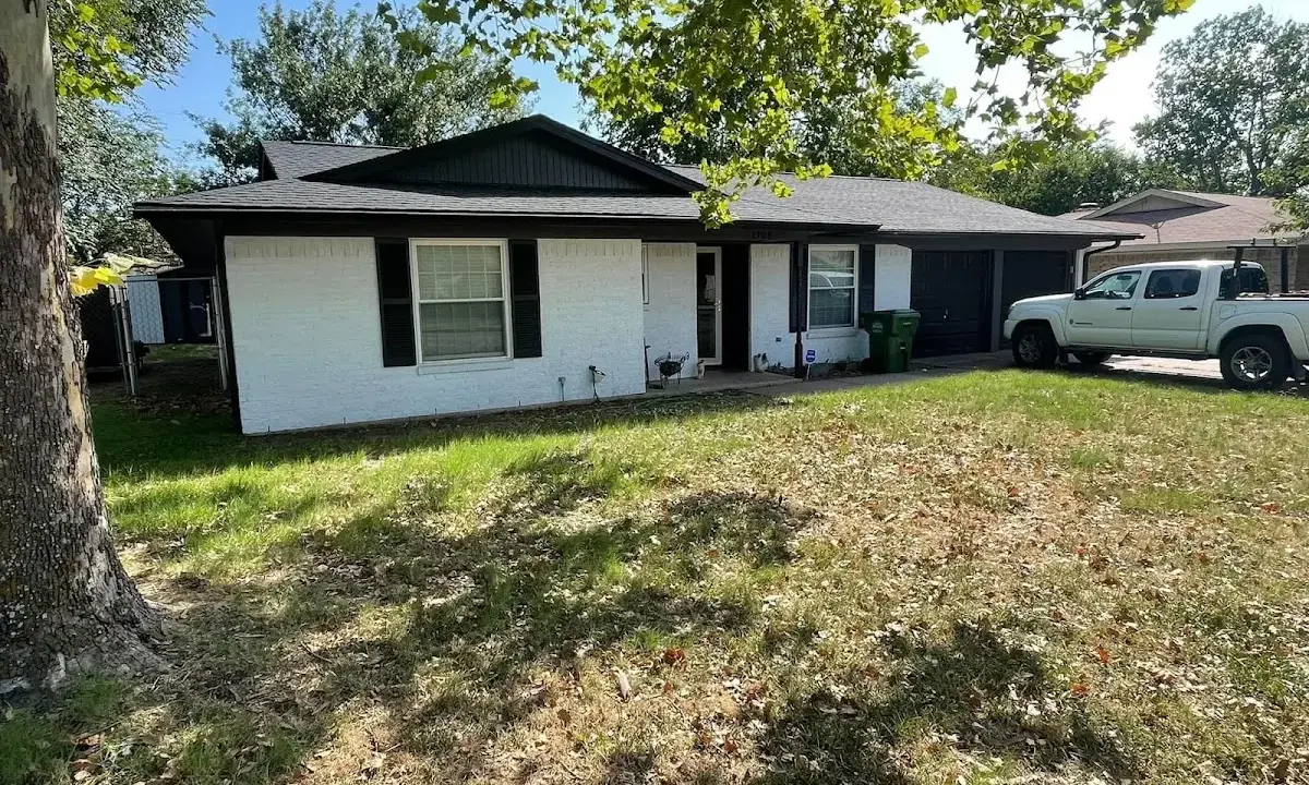 Professional roofing crew working on a residential roof in Grand Island